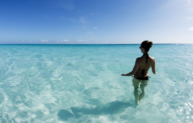 Woman in ocean for Bahamas DOTM article