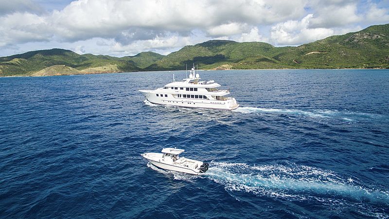 Mim yacht cruising with tender